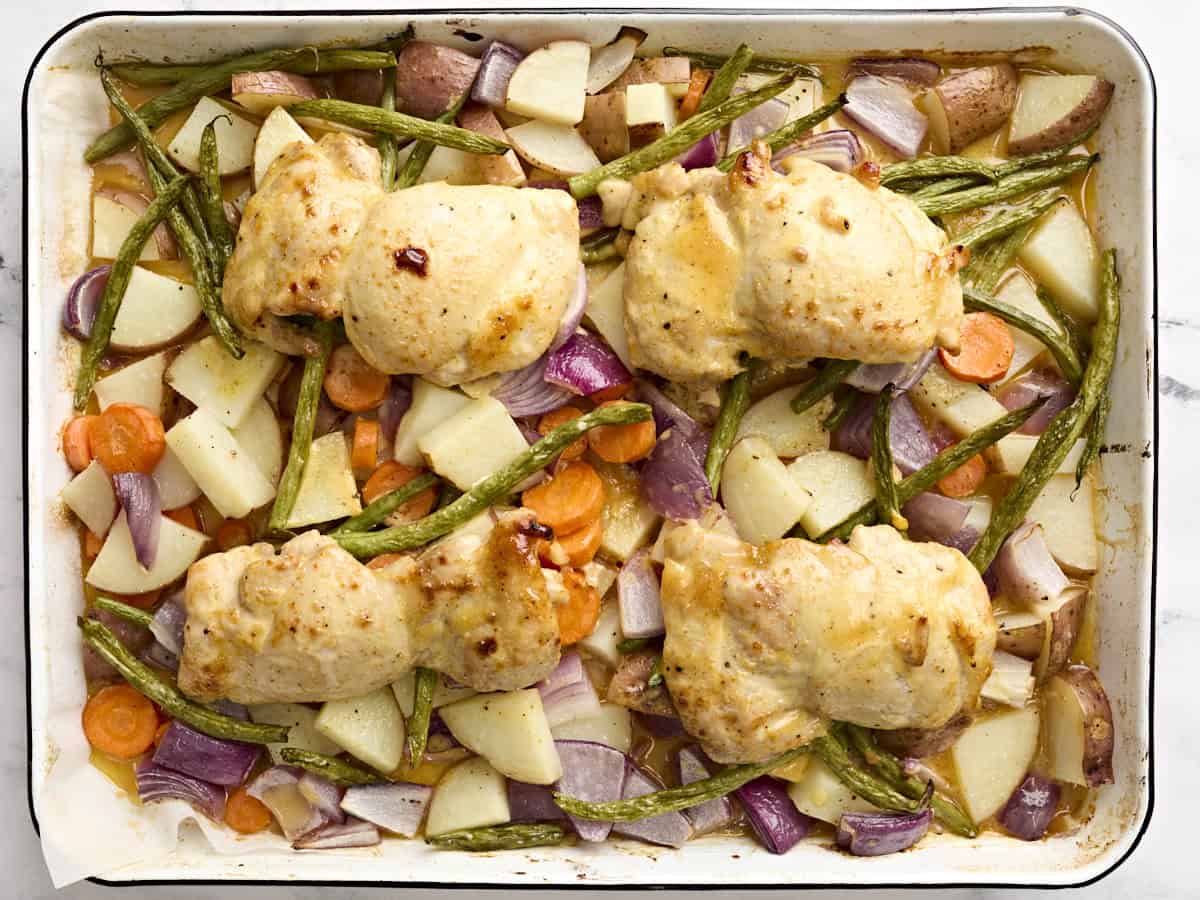 Baked sheet pan honey mustard chicken and vegetables.