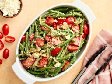 Overhead view of a green bean salad in a serving dish.