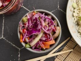 Overhead view of homemade kimchi in a bowl.