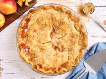 Overhead view of a homemade peach pie.