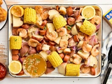 An overhead view of a shrimp boil on a sheet pan.