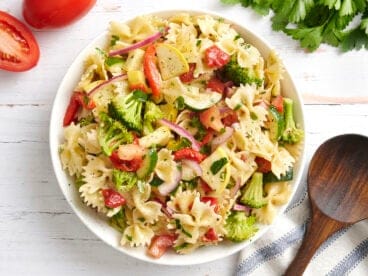 Overhead view of a bowl of summer vegetable pasta salad.